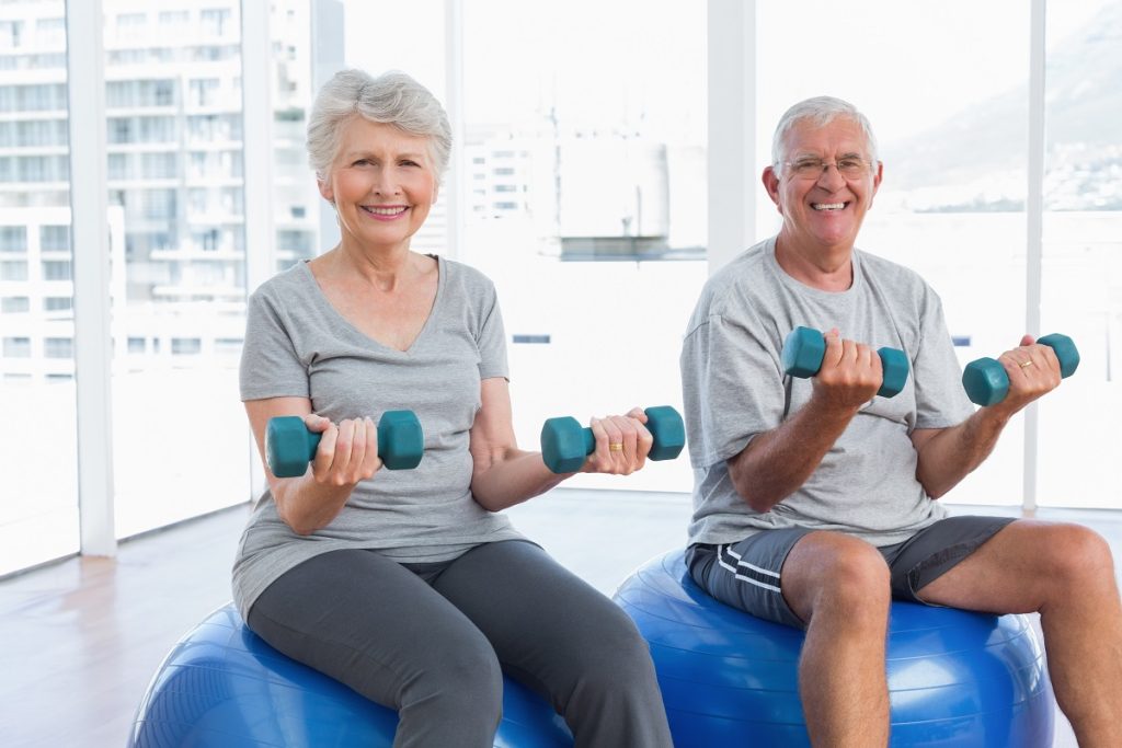 Couple lifting weights