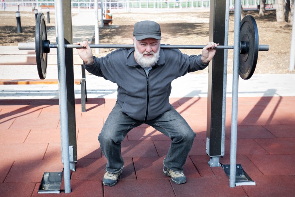 Old man lifting weights