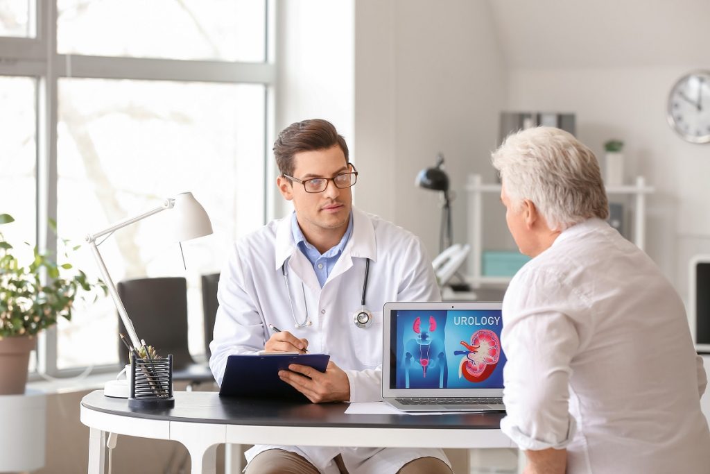 Senior discussing kidney issues with doctor