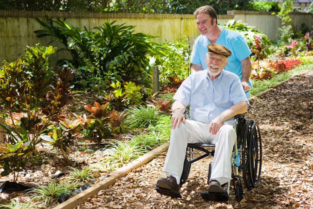 Senior on garden path