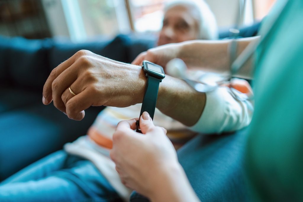 Caregiver reviewing smartwatch data