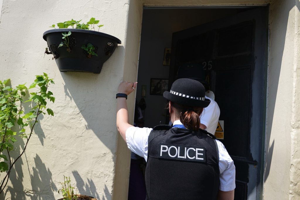 Officer knocking on door