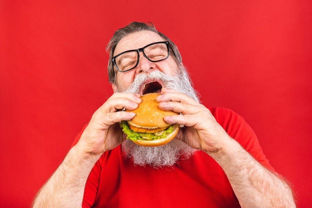 Senior eating fast food